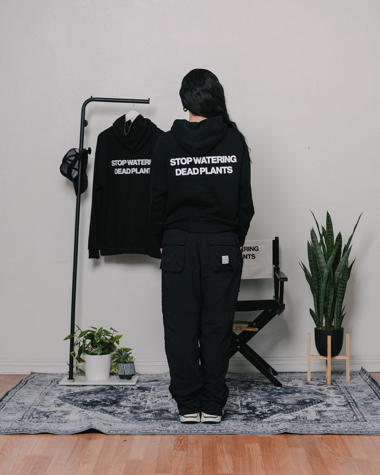Stop Watering Dead Plants 2.0 Relaxed Black Hoodie - trainofthoughtcollective